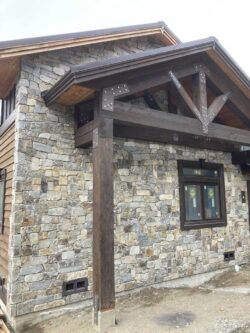 Custom Stone Veneer Natural stone veneer installation on a luxury residential exterior.