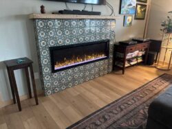 Modern Tiled Hearth Modern electric fireplace with a floor-to-ceiling patterned tile surround.
