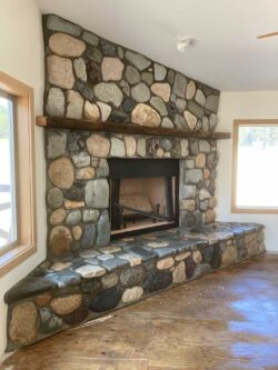 River Rock Artistry Custom hand-selected river rock fireplace and hearth masonry in Twisp, WA.